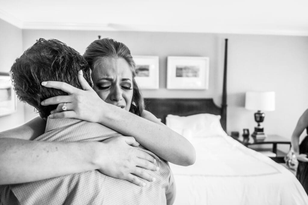 Emotional wedding morning moment as the bride embraces a loved one