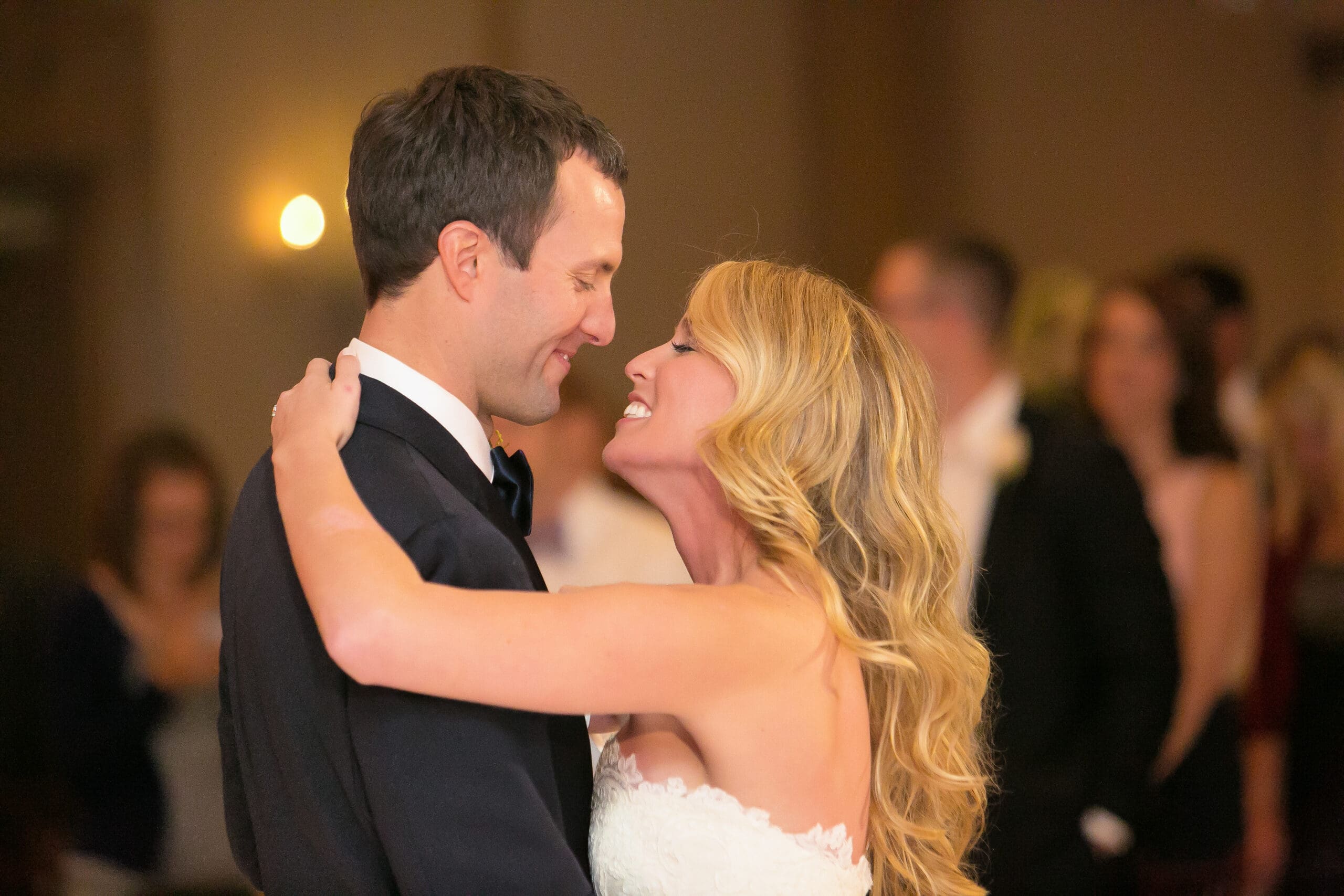 Bride comfortable in front camera interacting with family