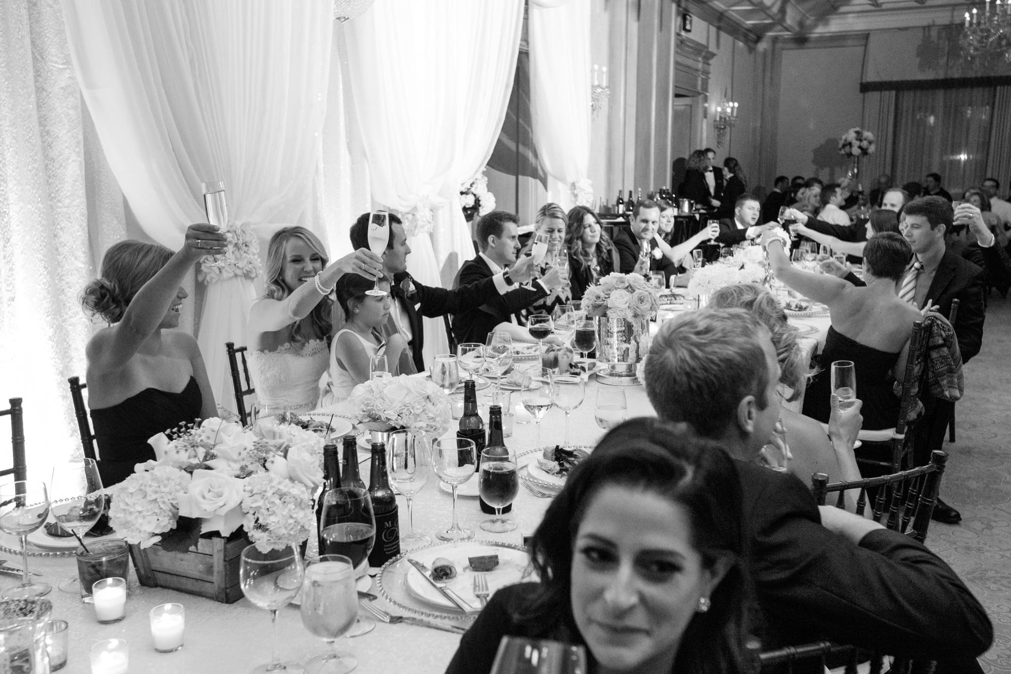 Candlelit reception tables with gold accents