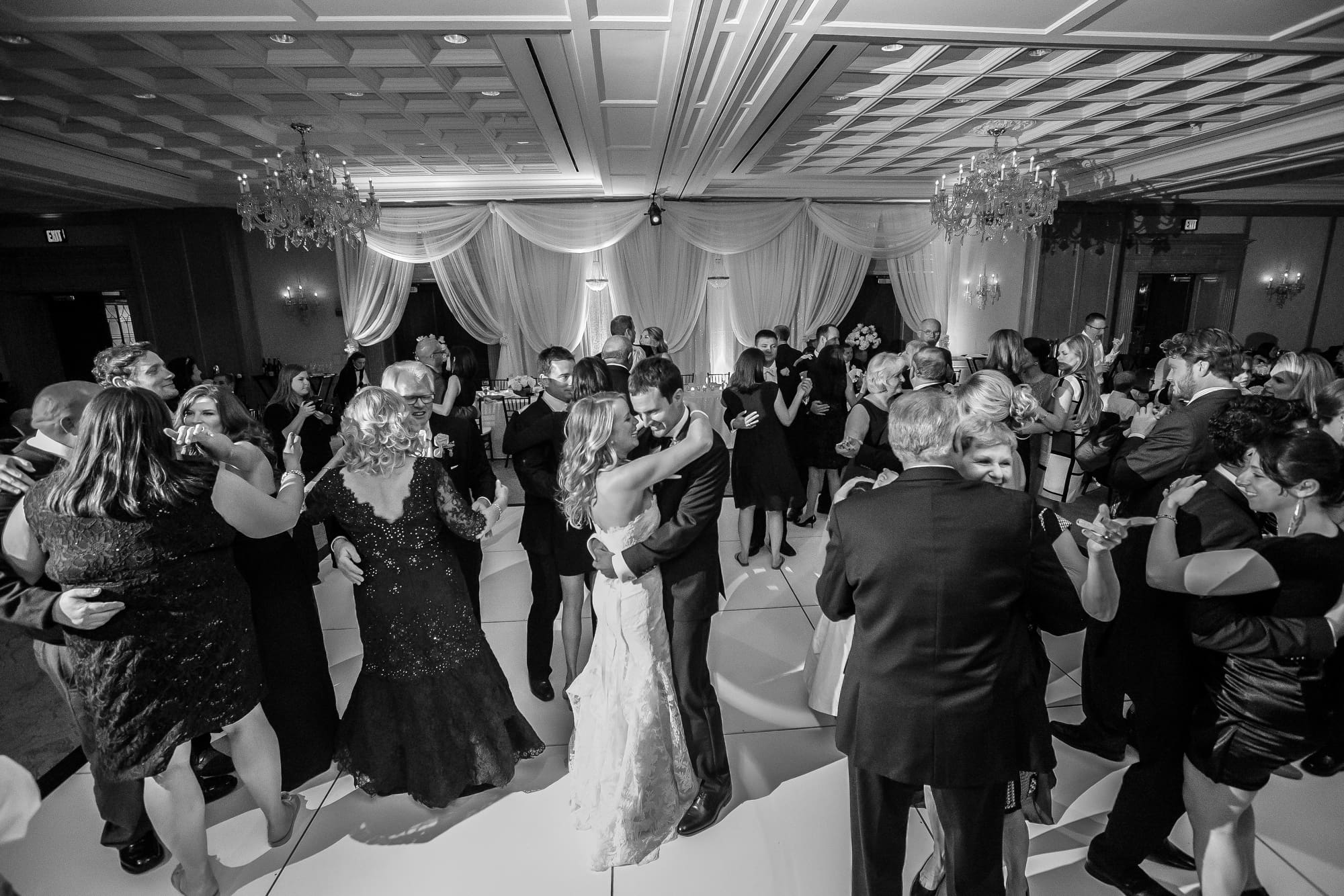Floral centerpiece with white roses and greenery
