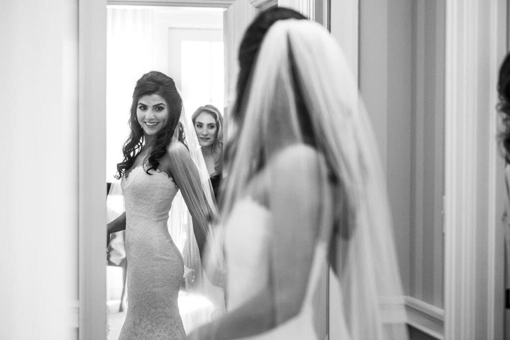 Bride seeing herself in the mirror before the ceremony.