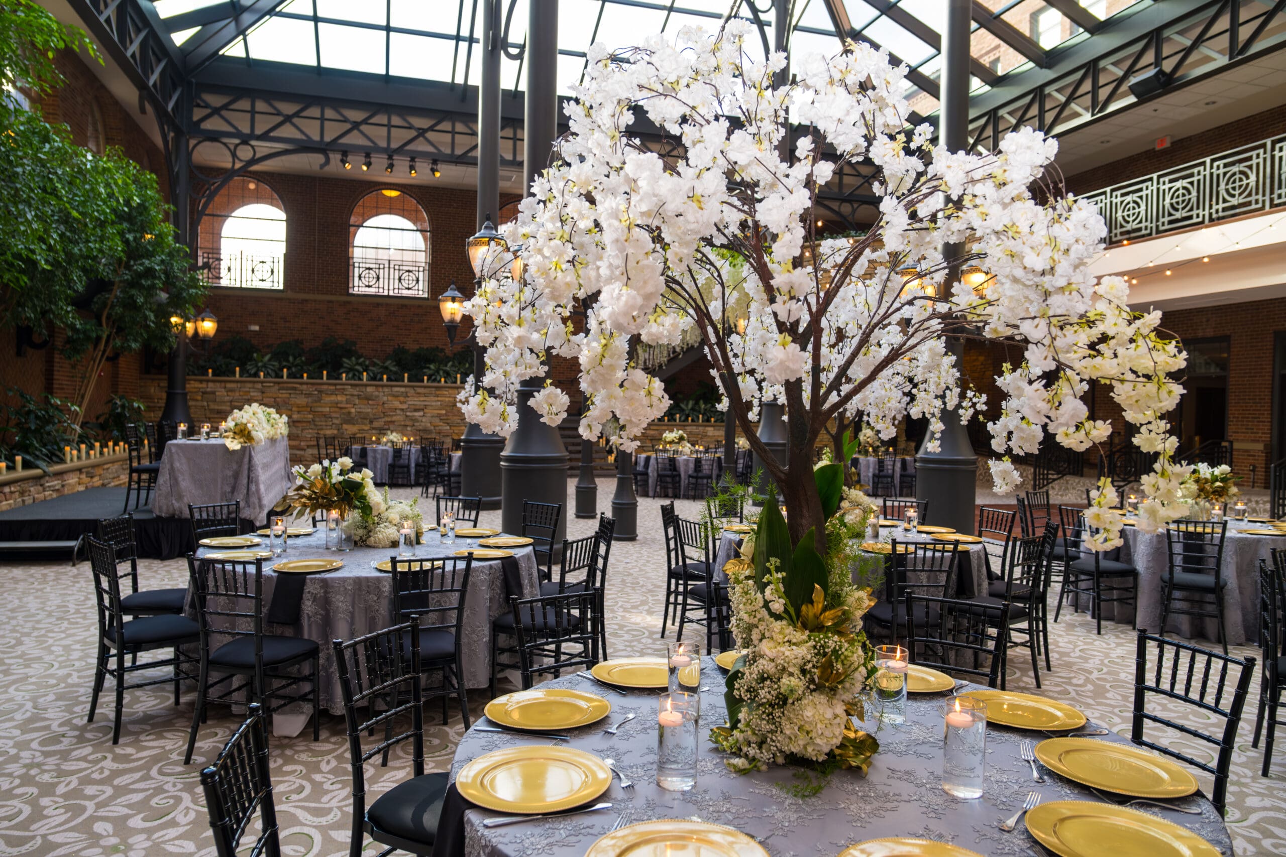 Reception tables arranged inside Saint Johns Resort Atrium