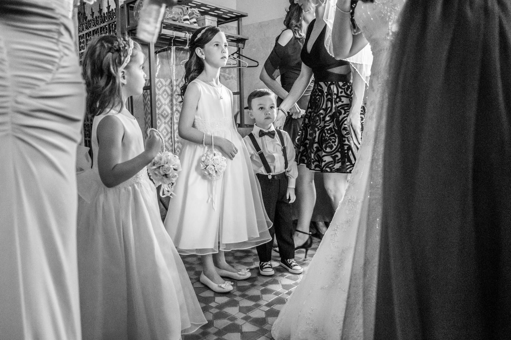 young ring bearer holding the wedding rings