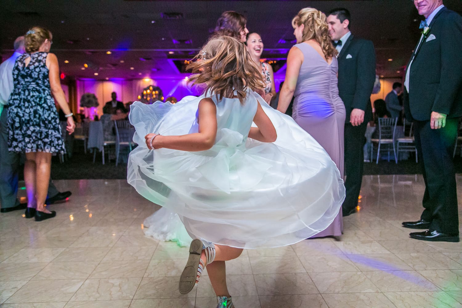 flower girl holding a basket before walking down the aisle