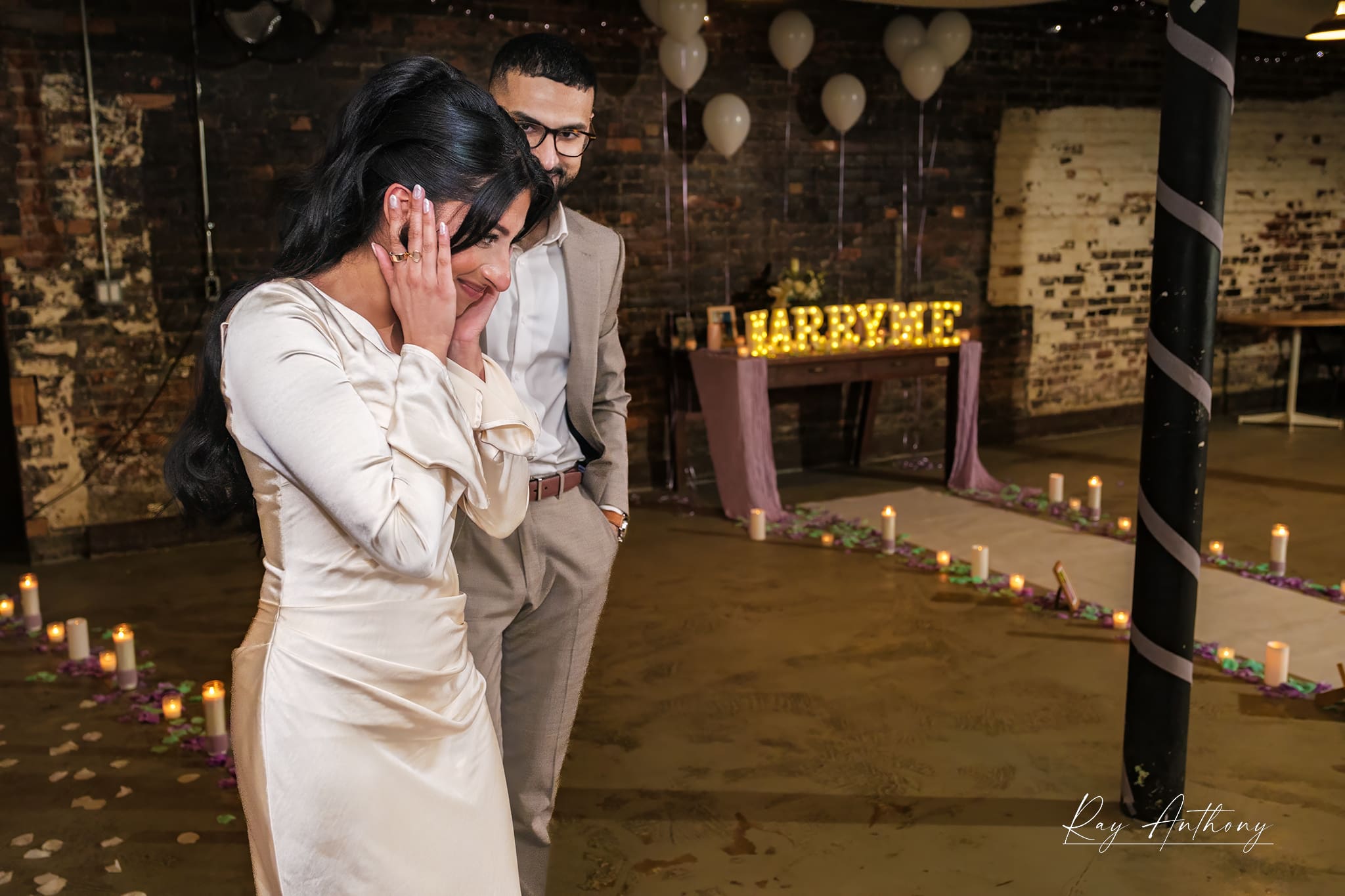 Manvir walking into decorated proposal space at The Congregation