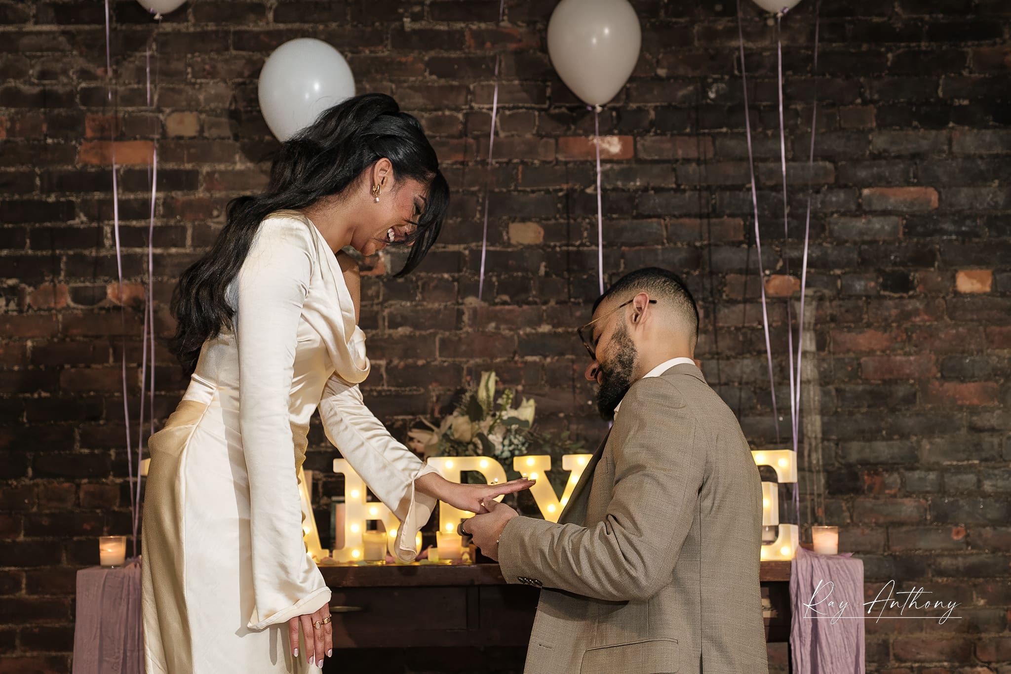 candid laughter after engagement moment