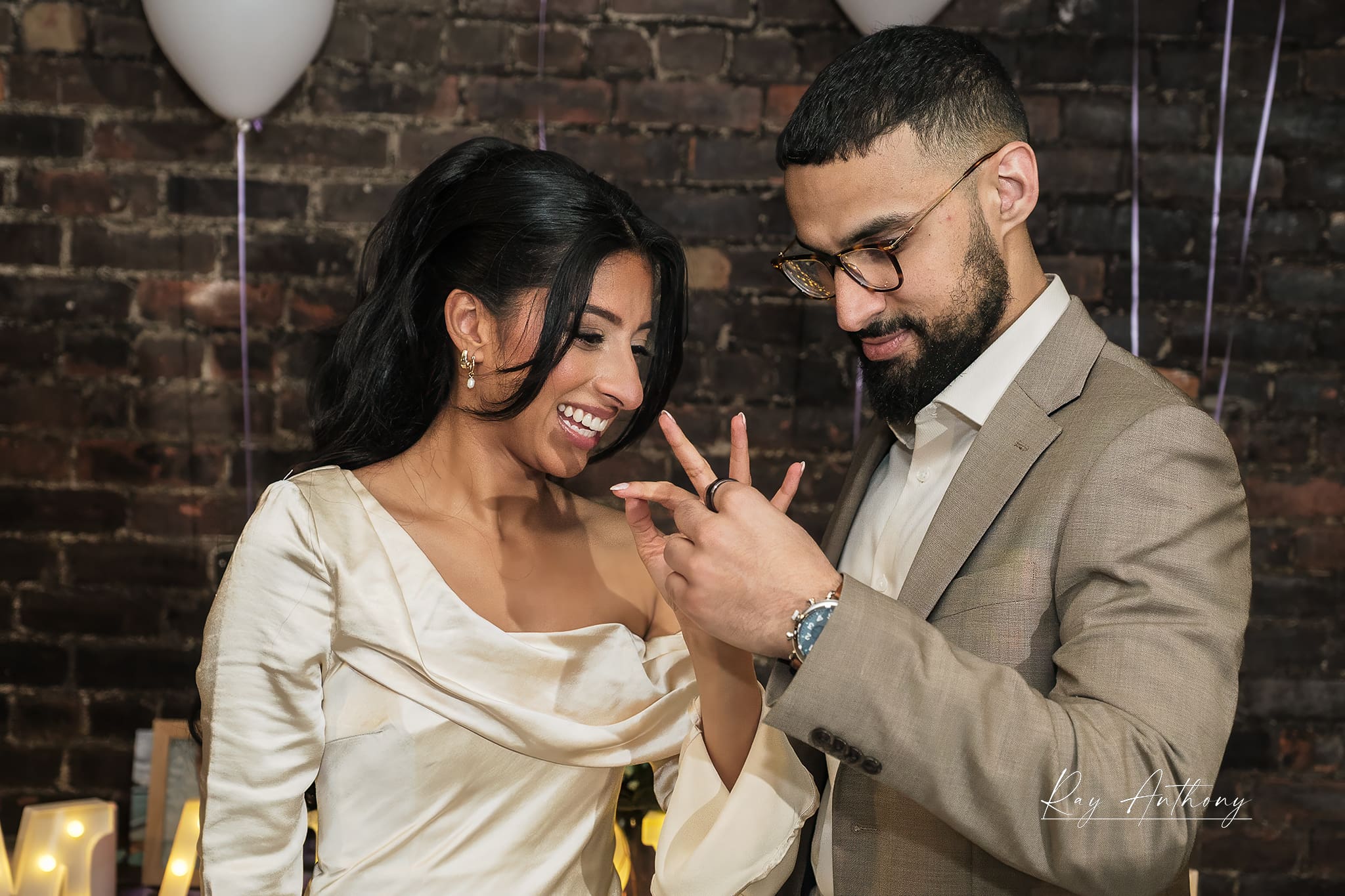couple celebrating engagement together indoors