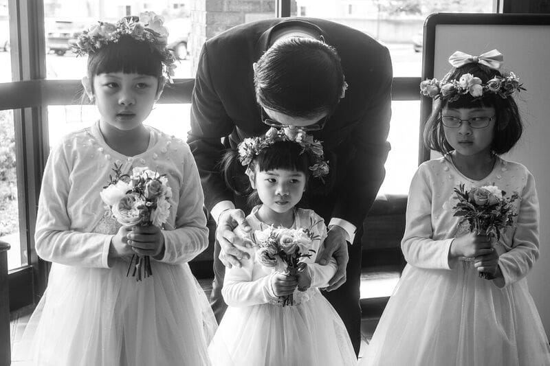 flower girl smiling during a wedding ceremony