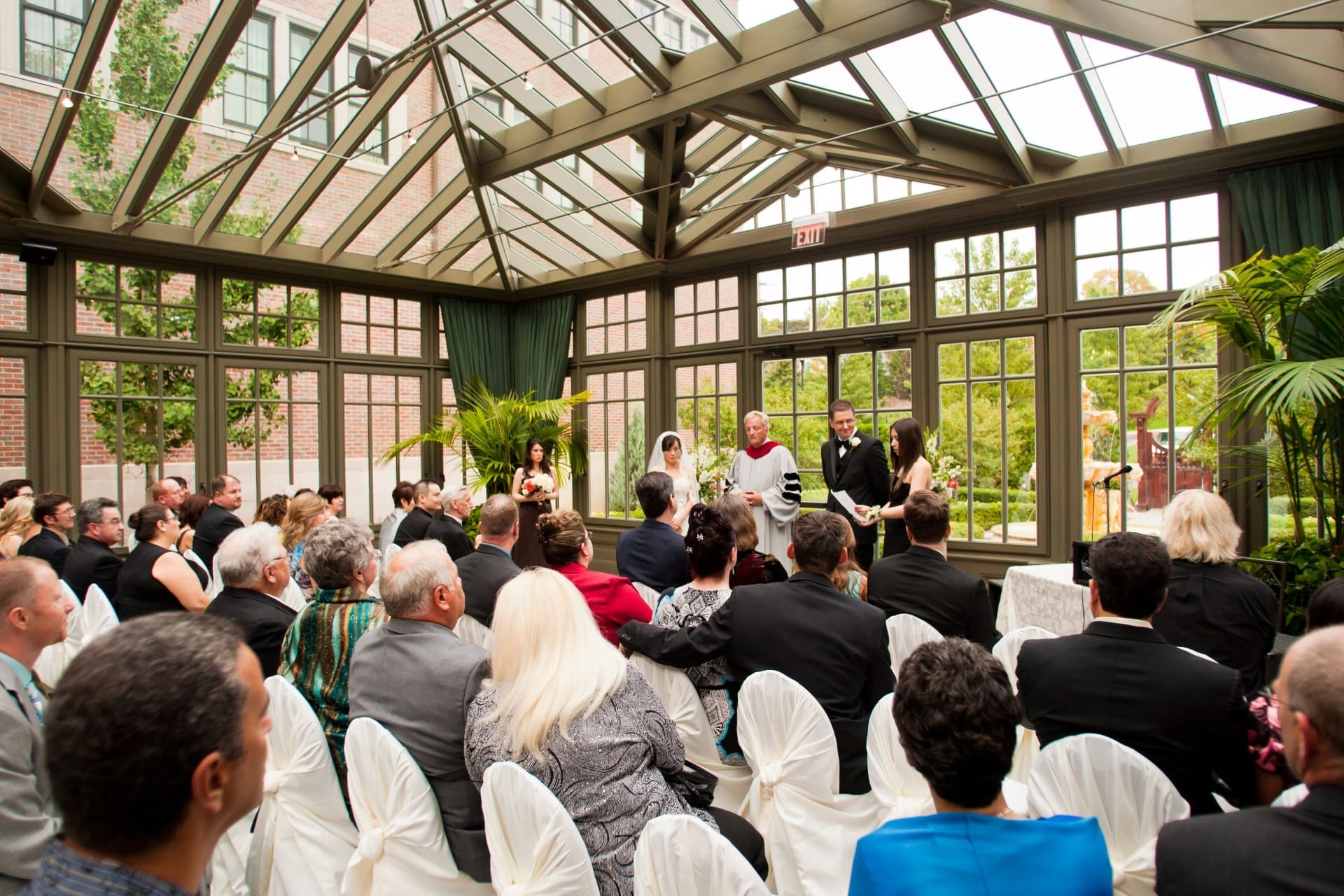 Bride and groom exchanging vows during an intimate wedding ceremony.