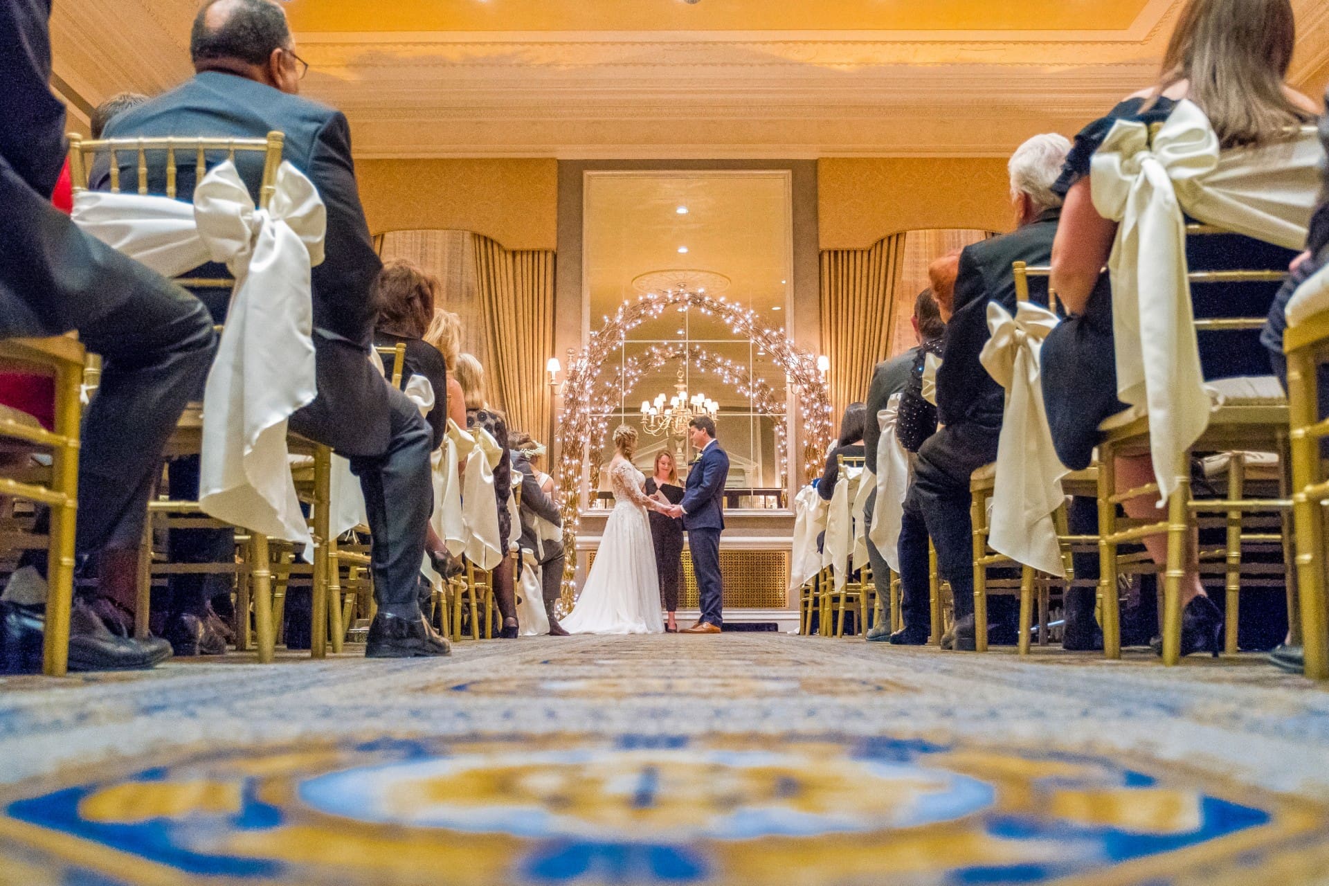 Bride and groom standing at the altar during their wedding ceremony.