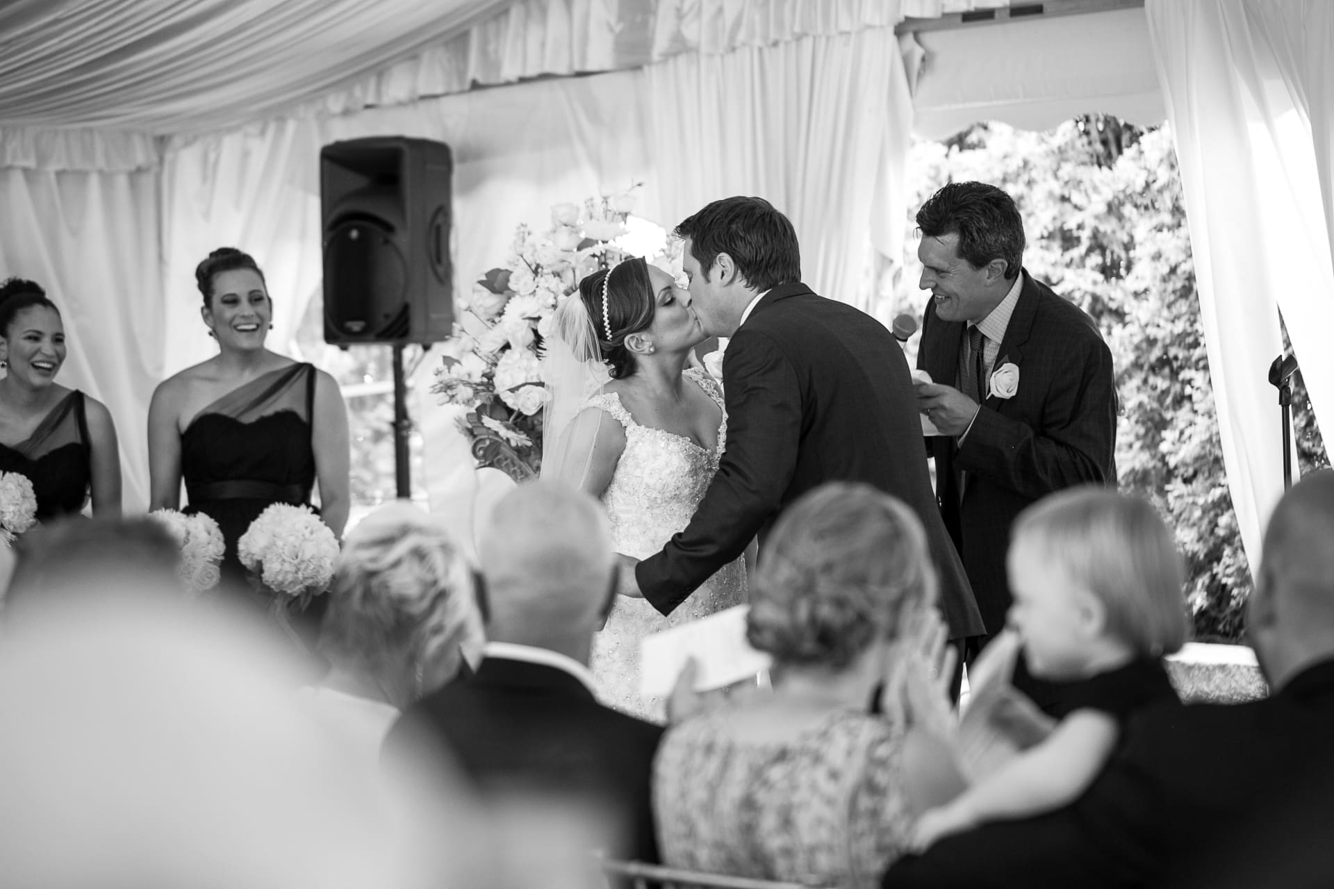 Bride and groom sharing a romantic moment during their wedding ceremony.