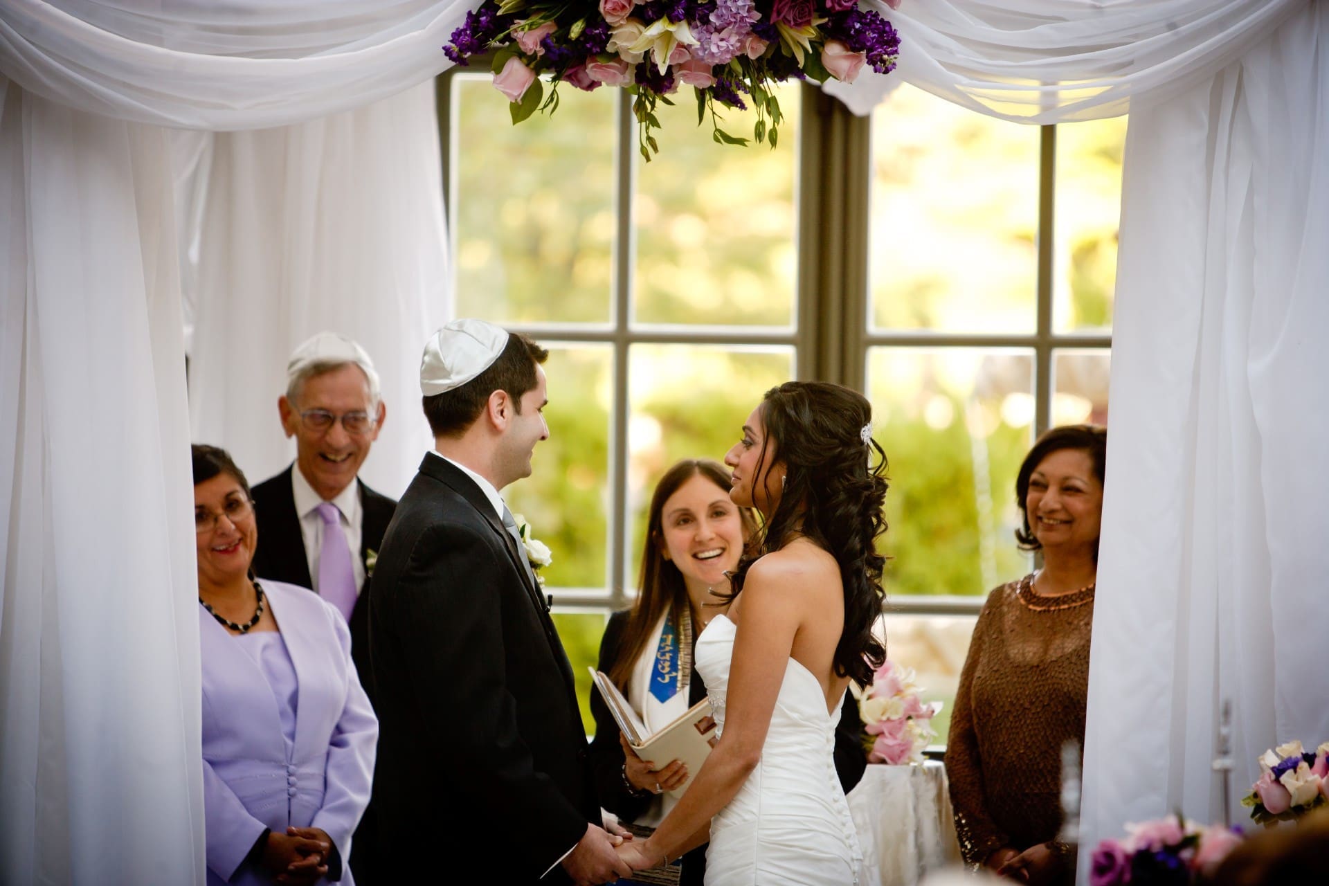 Wedding officiant speaking during the bride and groom's ceremony.