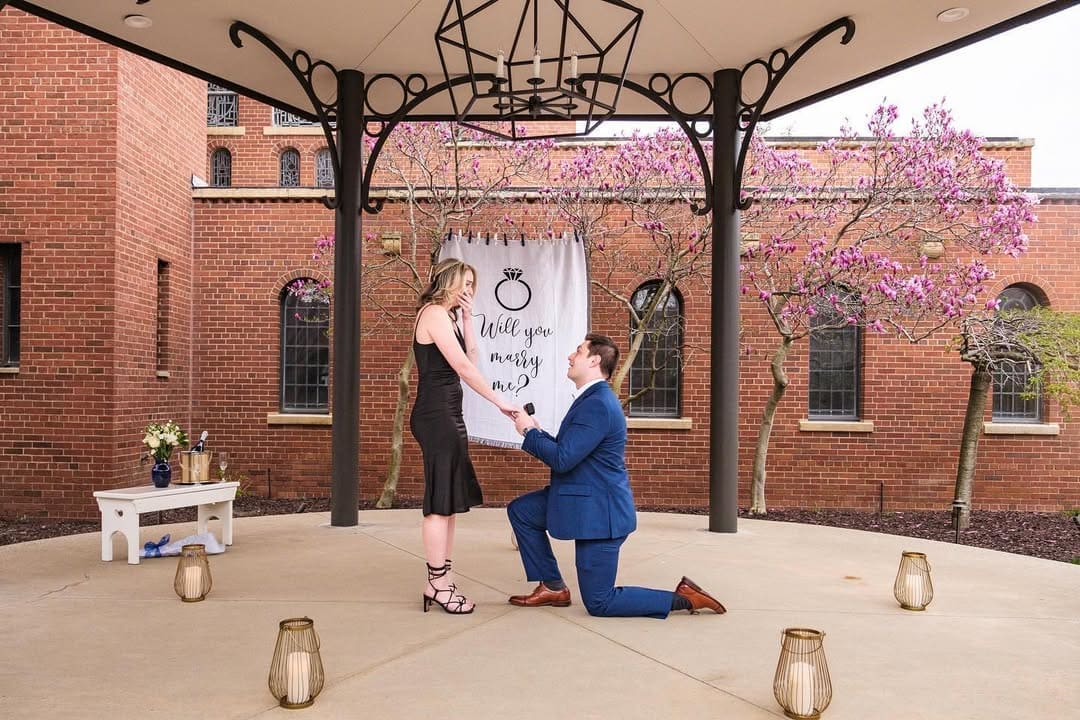 Detroit proposal photo session featuring a couple dressed in stylish engagement photo outfits.