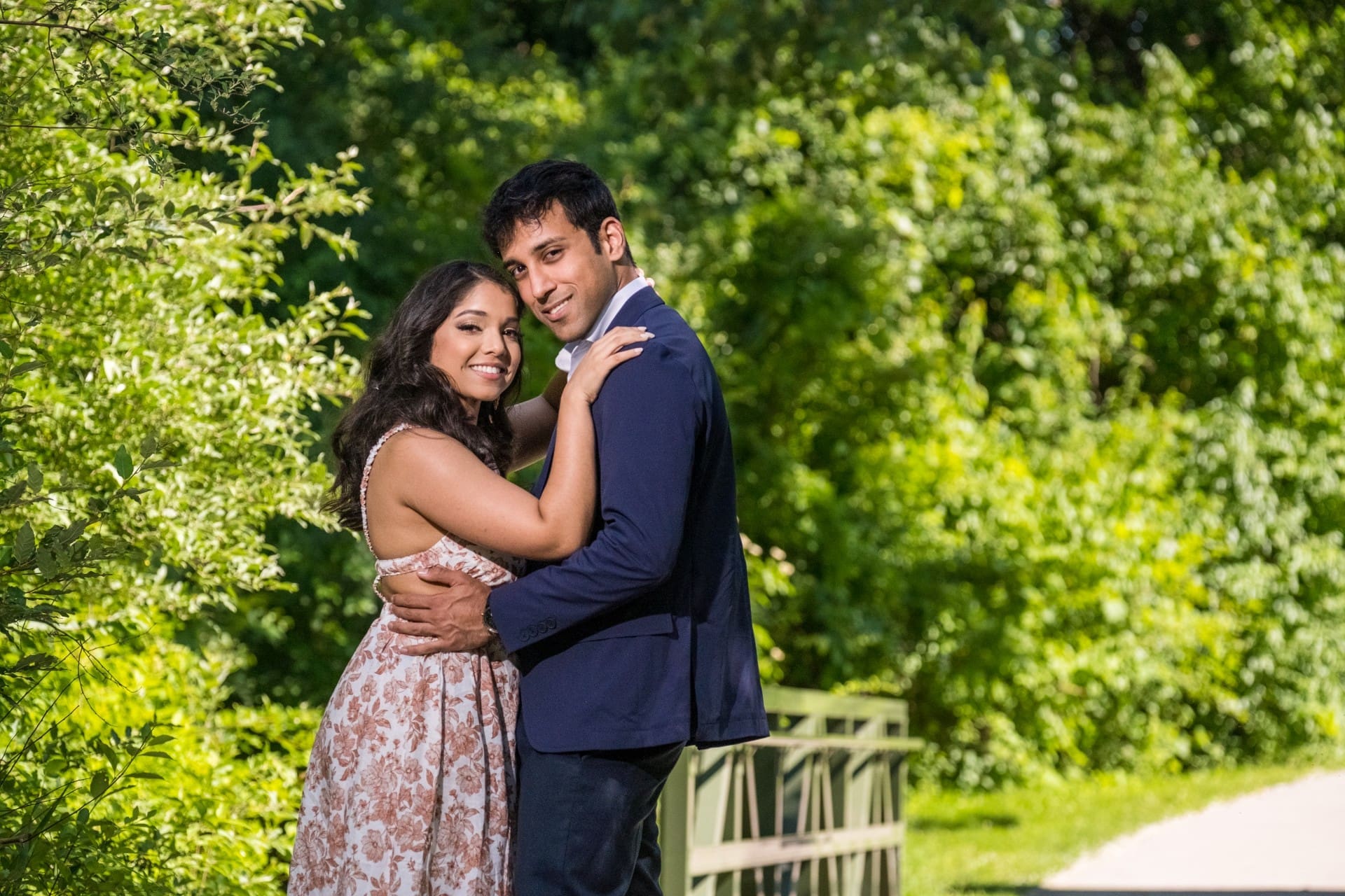 Couple sharing a romantic embrace during a golden hour couples portrait in Detroit.