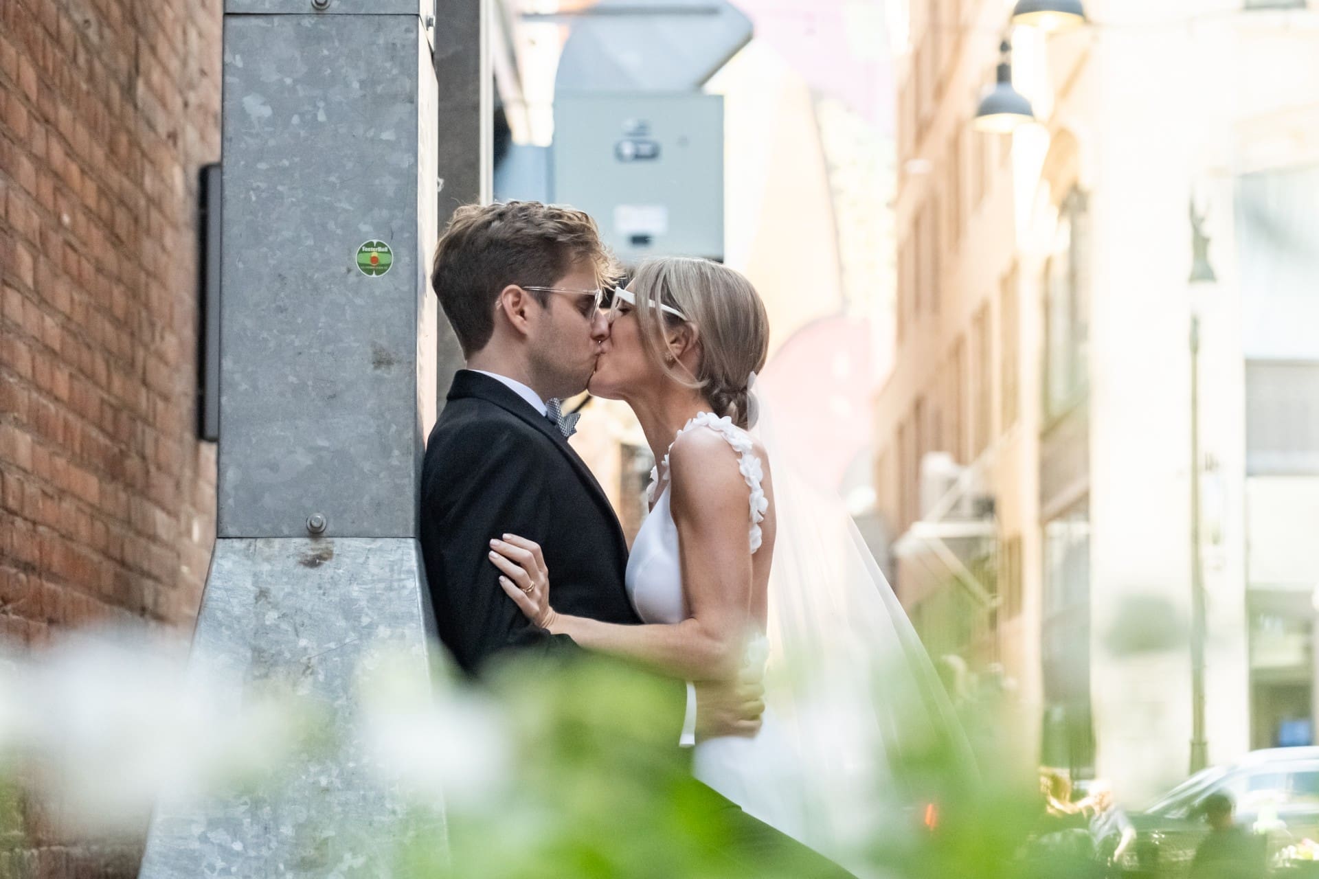 Bride and groom embracing during a romantic downtown Detroit wedding portrait.