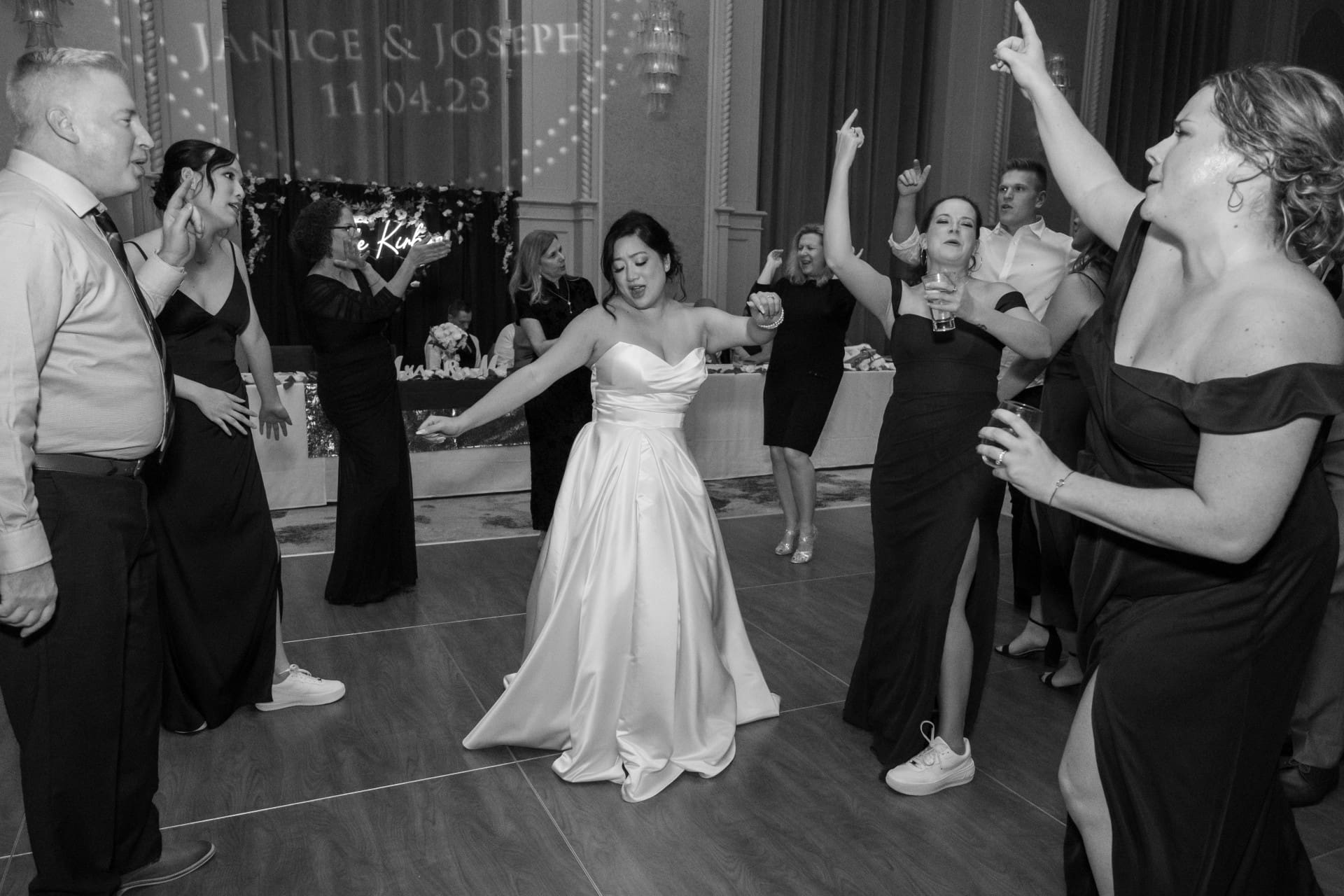 Bride dancing with guests during a Detroit wedding reception