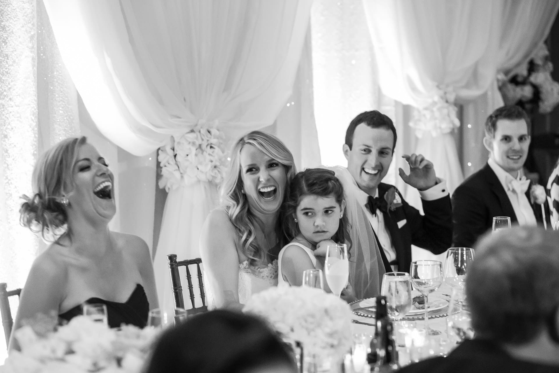 Bride and groom celebrating with family and friends during the reception