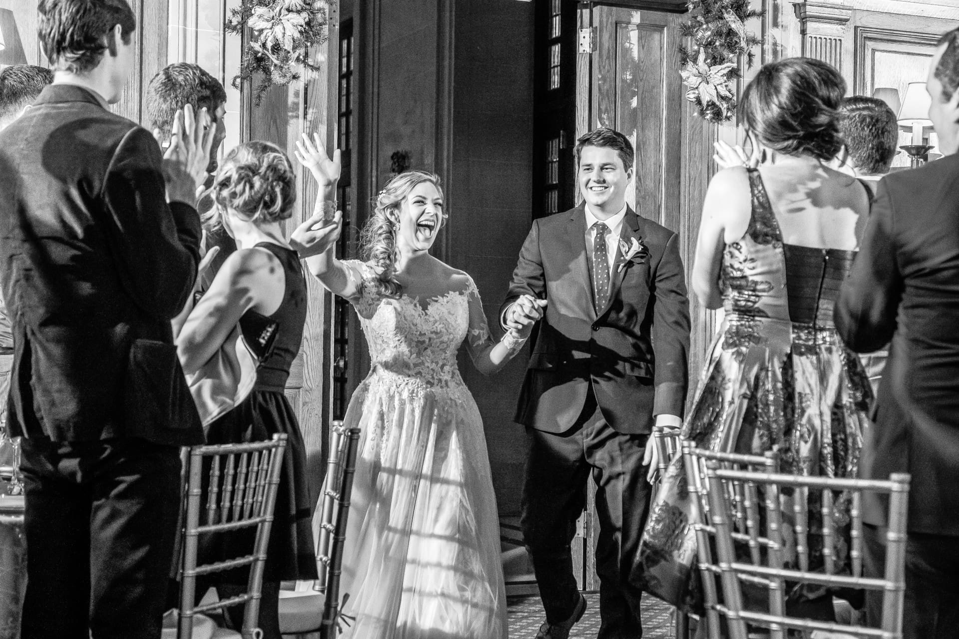 Bride and groom sharing a candid moment with family and guests during the wedding