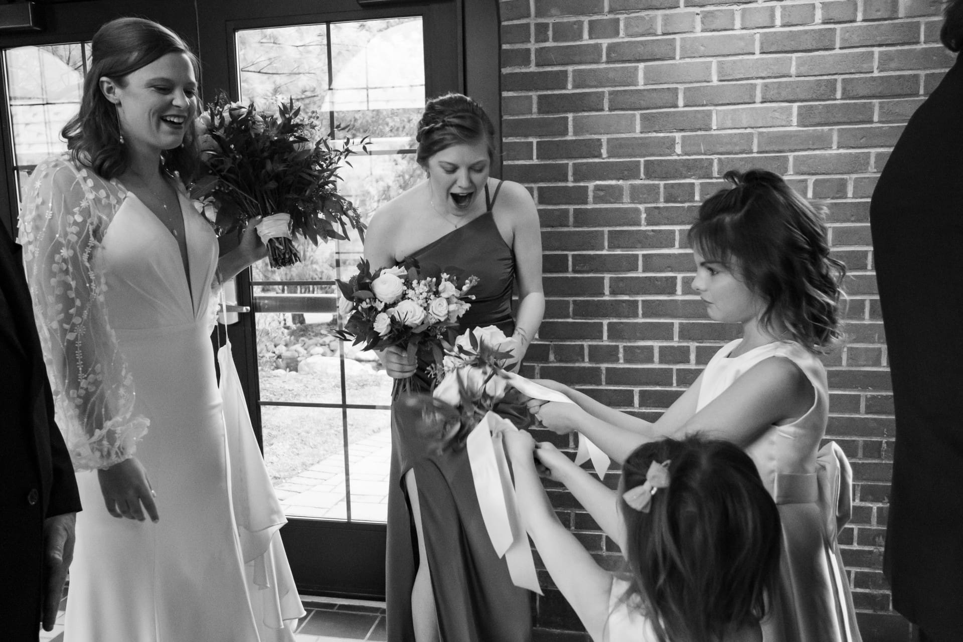 Bride and guests sharing a candid moment during a wedding celebration