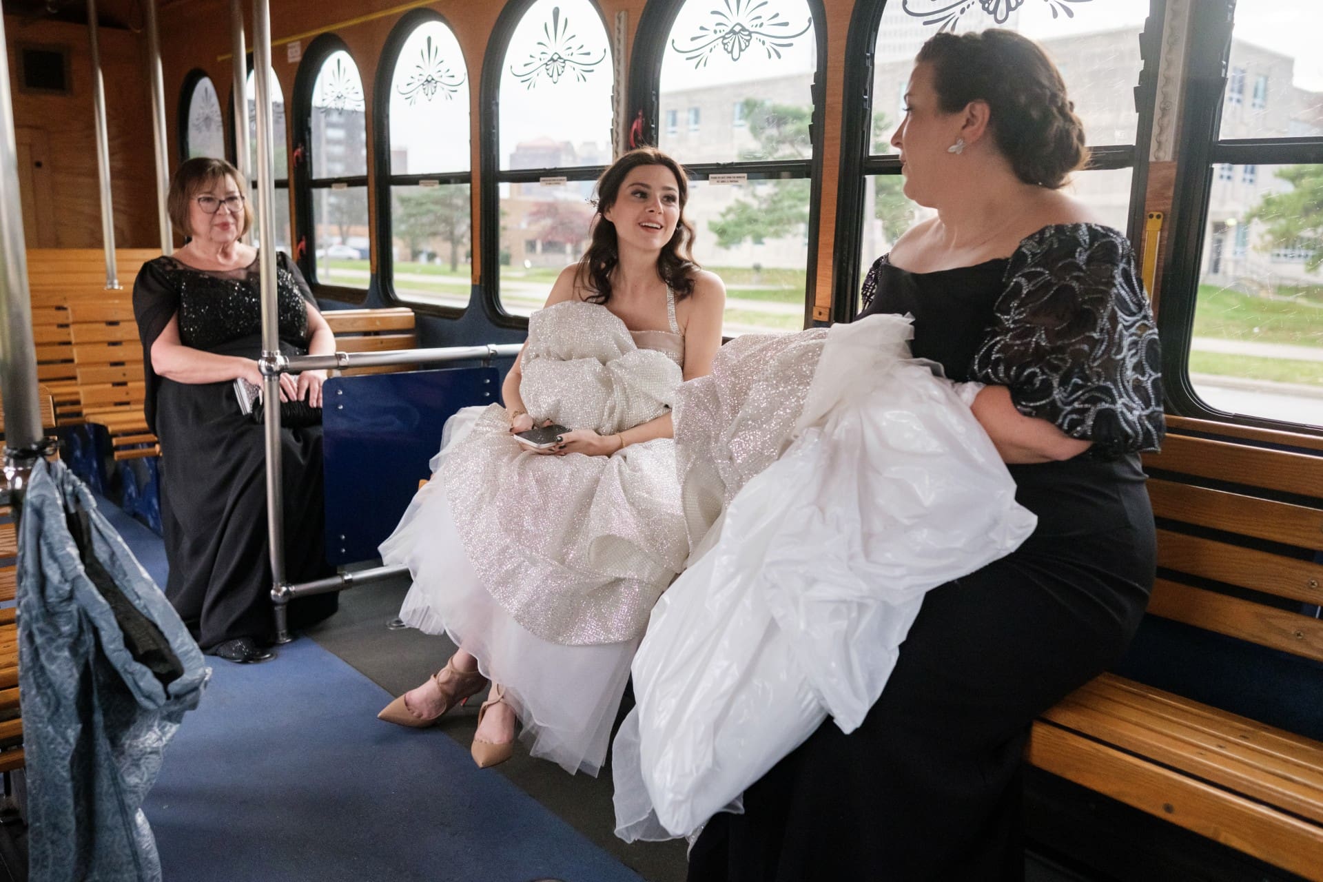 Bride sharing a candid moment with family during a Detroit wedding
