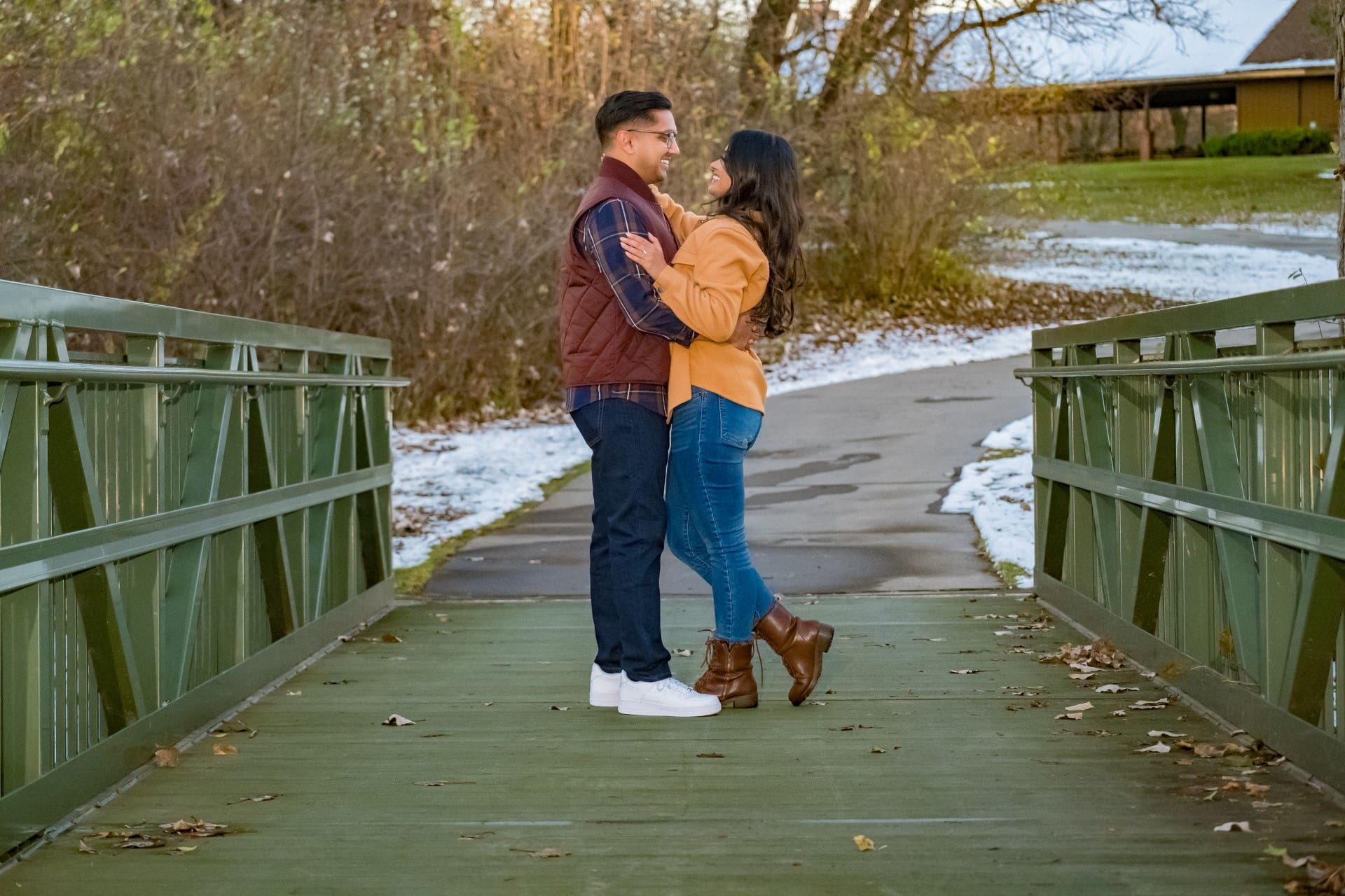 Couple embracing on a bridge in Plymouth, Michigan
