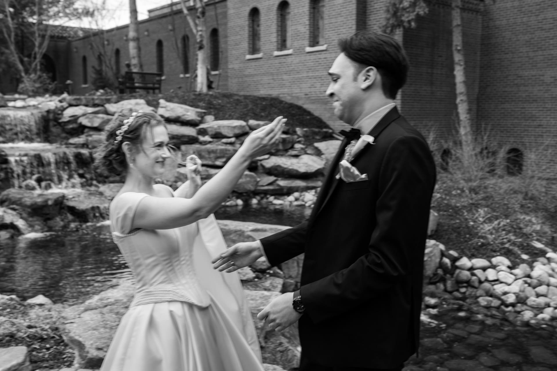 Bride and groom sharing a romantic first look outdoors at a Michigan wedding venue
