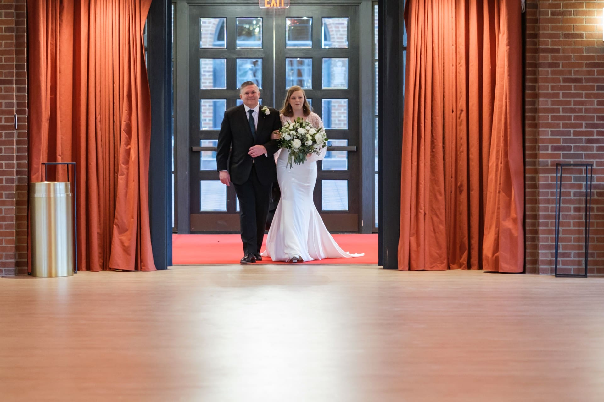 Andrew and Rachel standing together at their St. John’s Resort wedding reception in Plymouth, Michigan