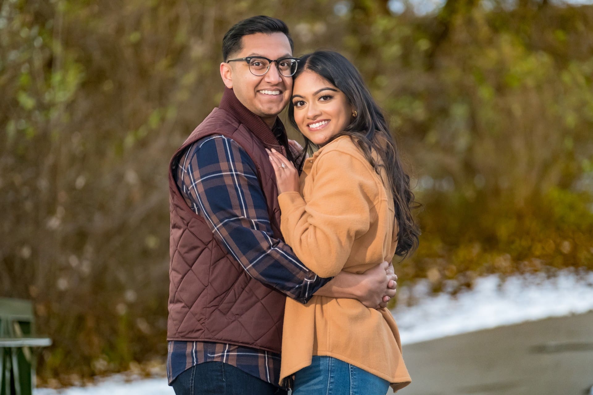 Couple embracing during a surprise proposal in Plymouth