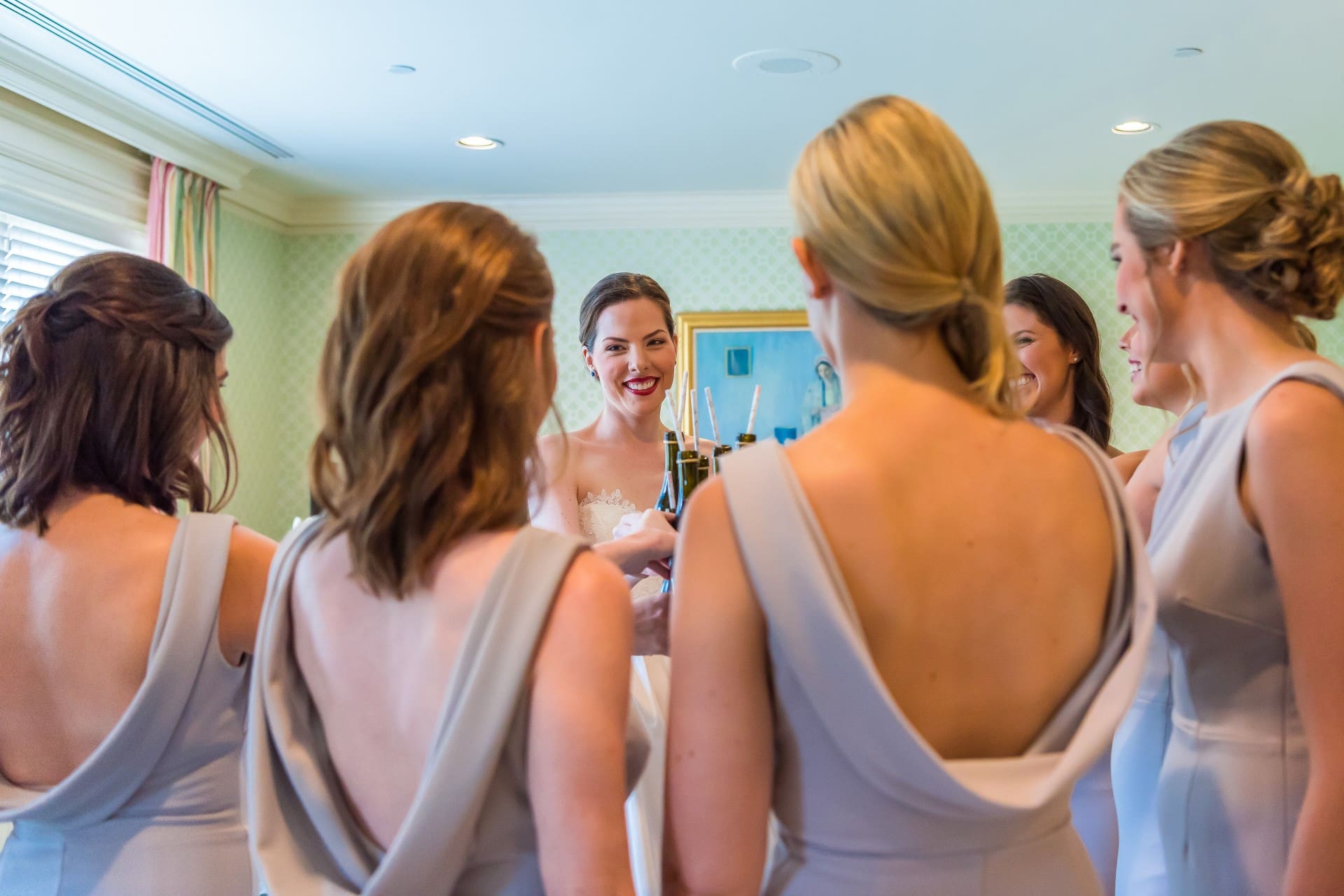 Bride spending time with her bridesmaids before the wedding ceremony