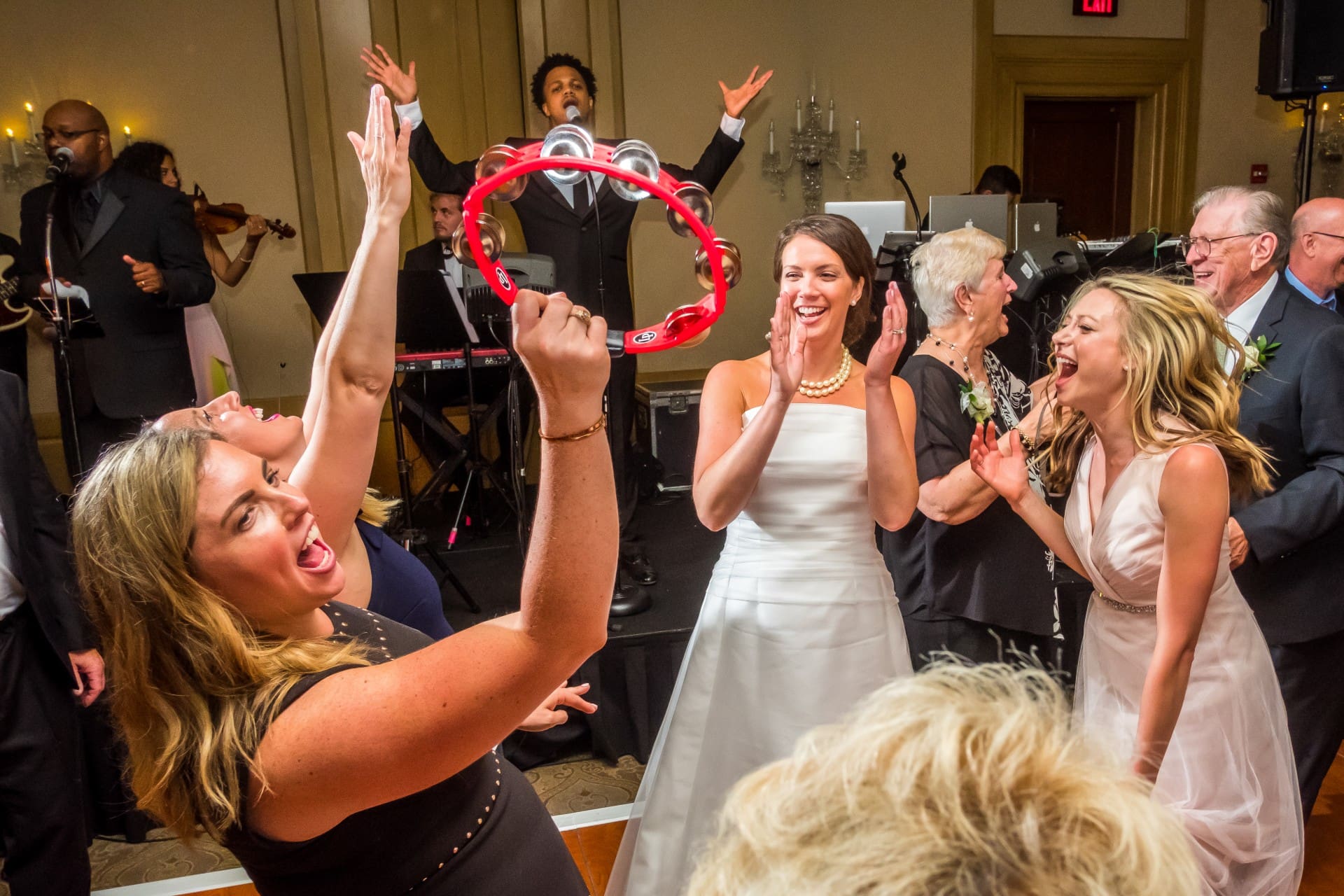 Wedding guests celebrating together on the dance floor