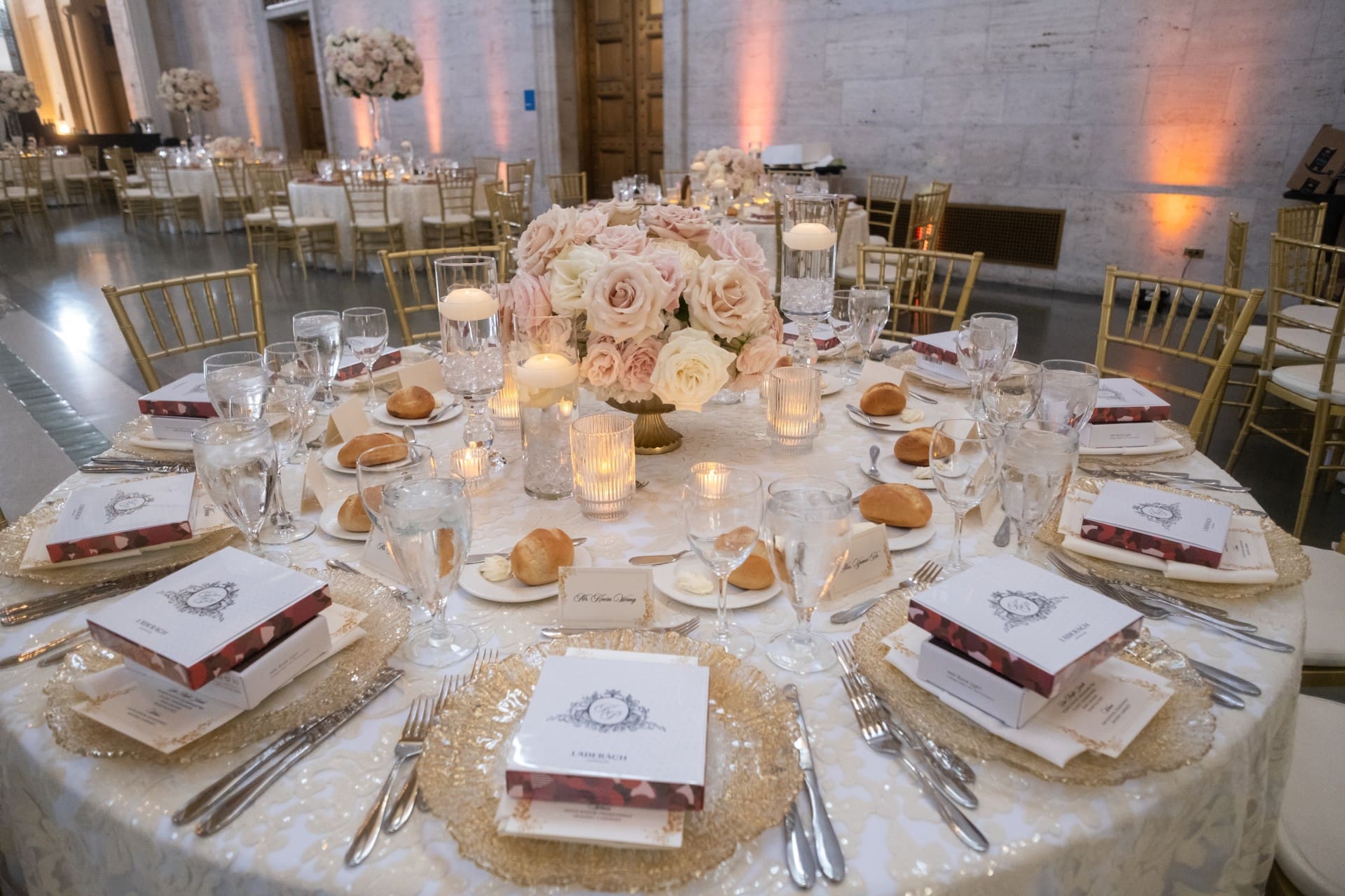 Elegant anniversary table setting with floral centerpiece, candles, and place settings at the Chang 50th Anniversary