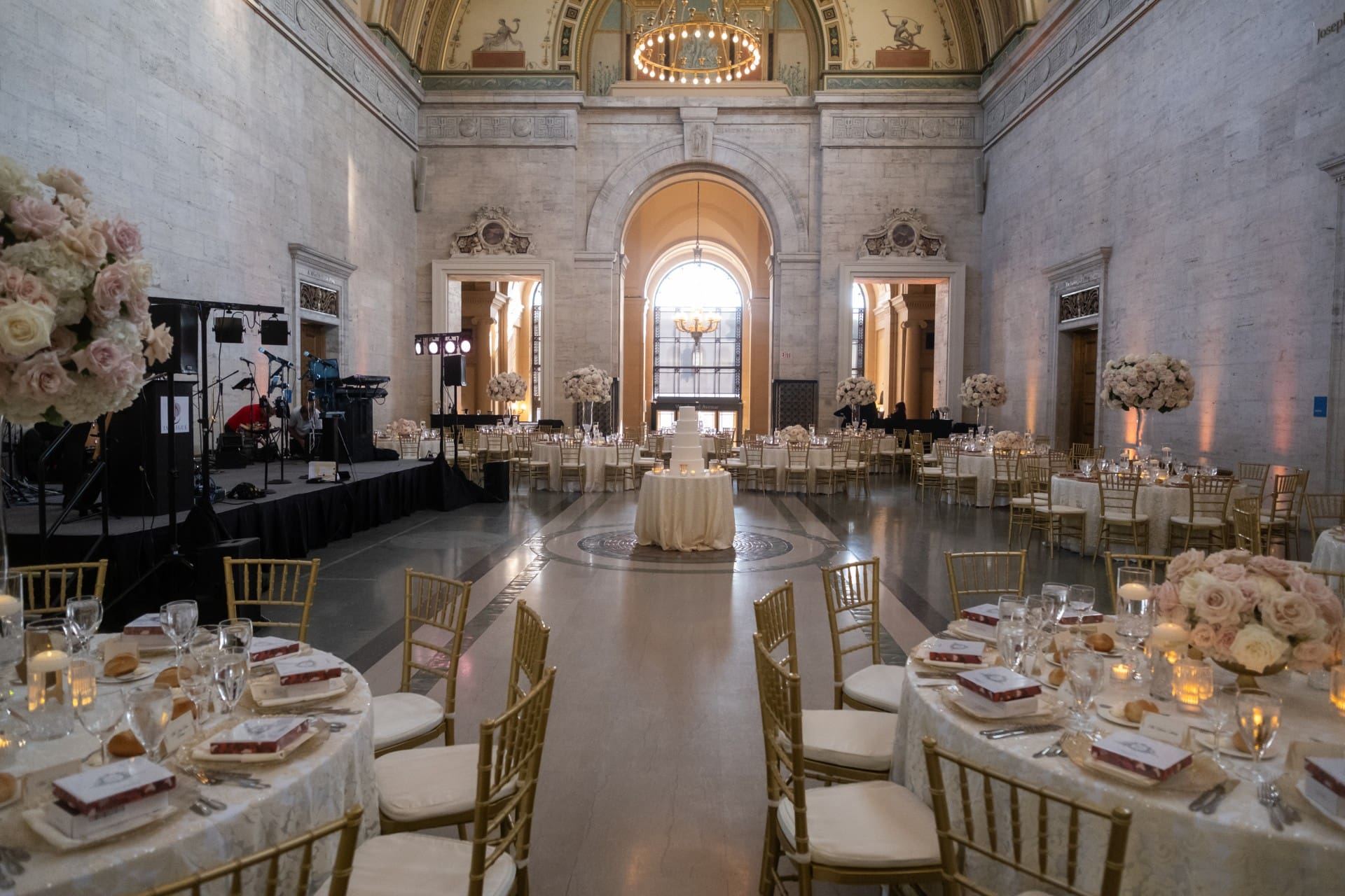 Elegant ballroom with floral table arrangements and guests celebrating the Chang 50th Anniversary at the Detroit Institute of Arts