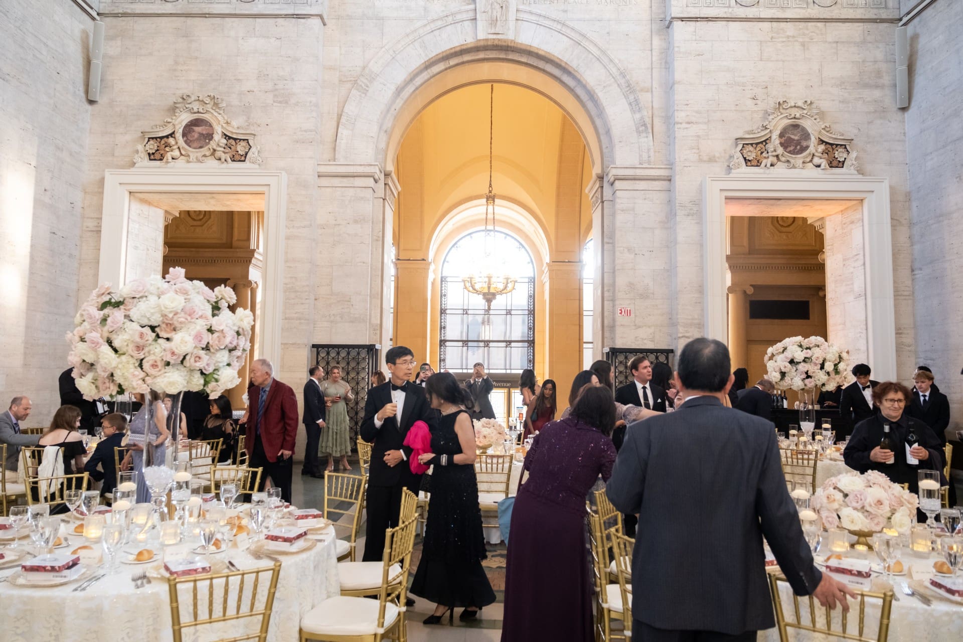 Detroit event photography capturing guests and elegant floral tablescapes at the Chang 50th Anniversary celebration at the Detroit Institute of Arts