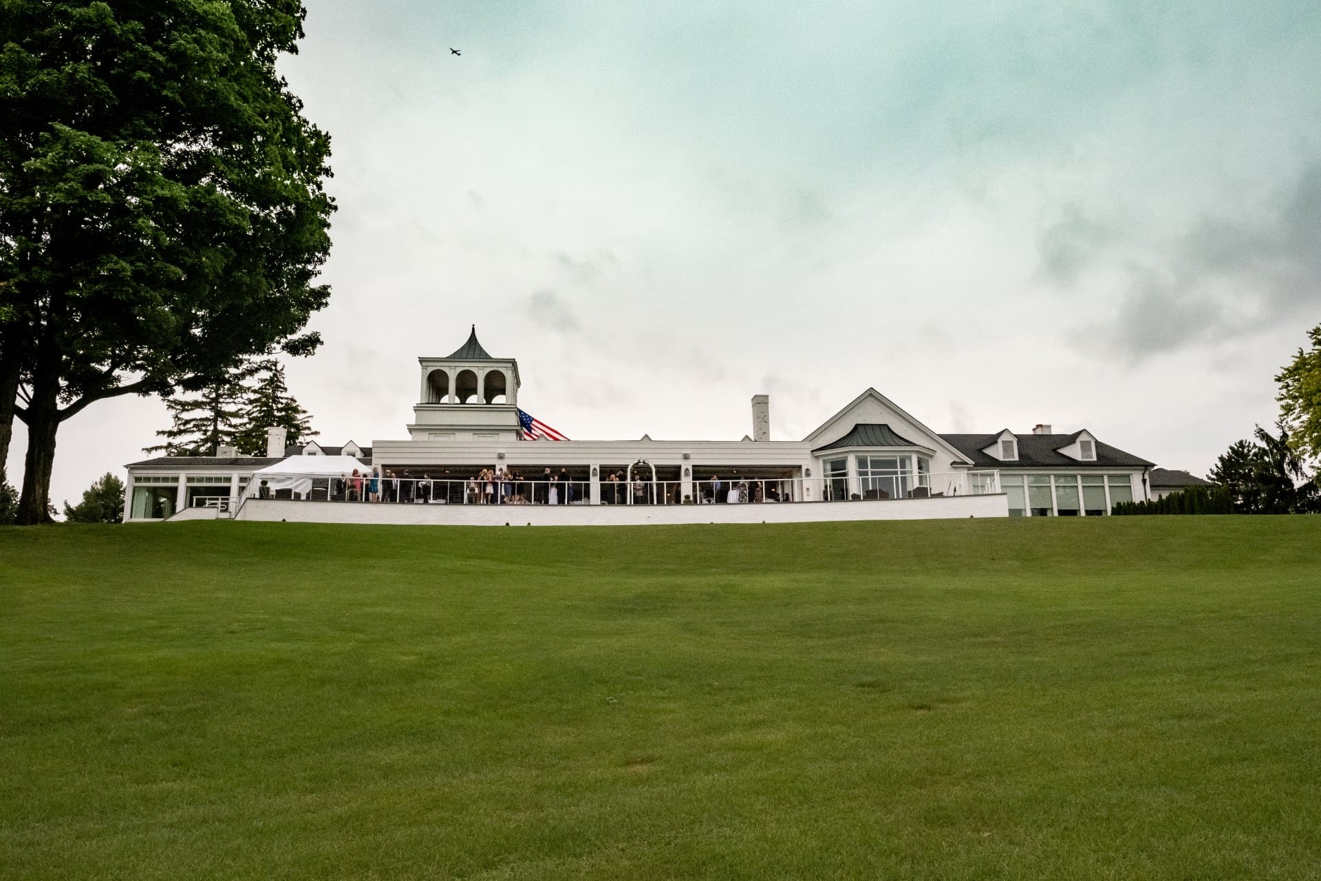 Elegant country club building surrounded by a wide green lawn